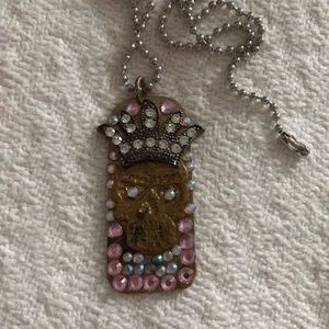 Skull with pink crystal dog tag